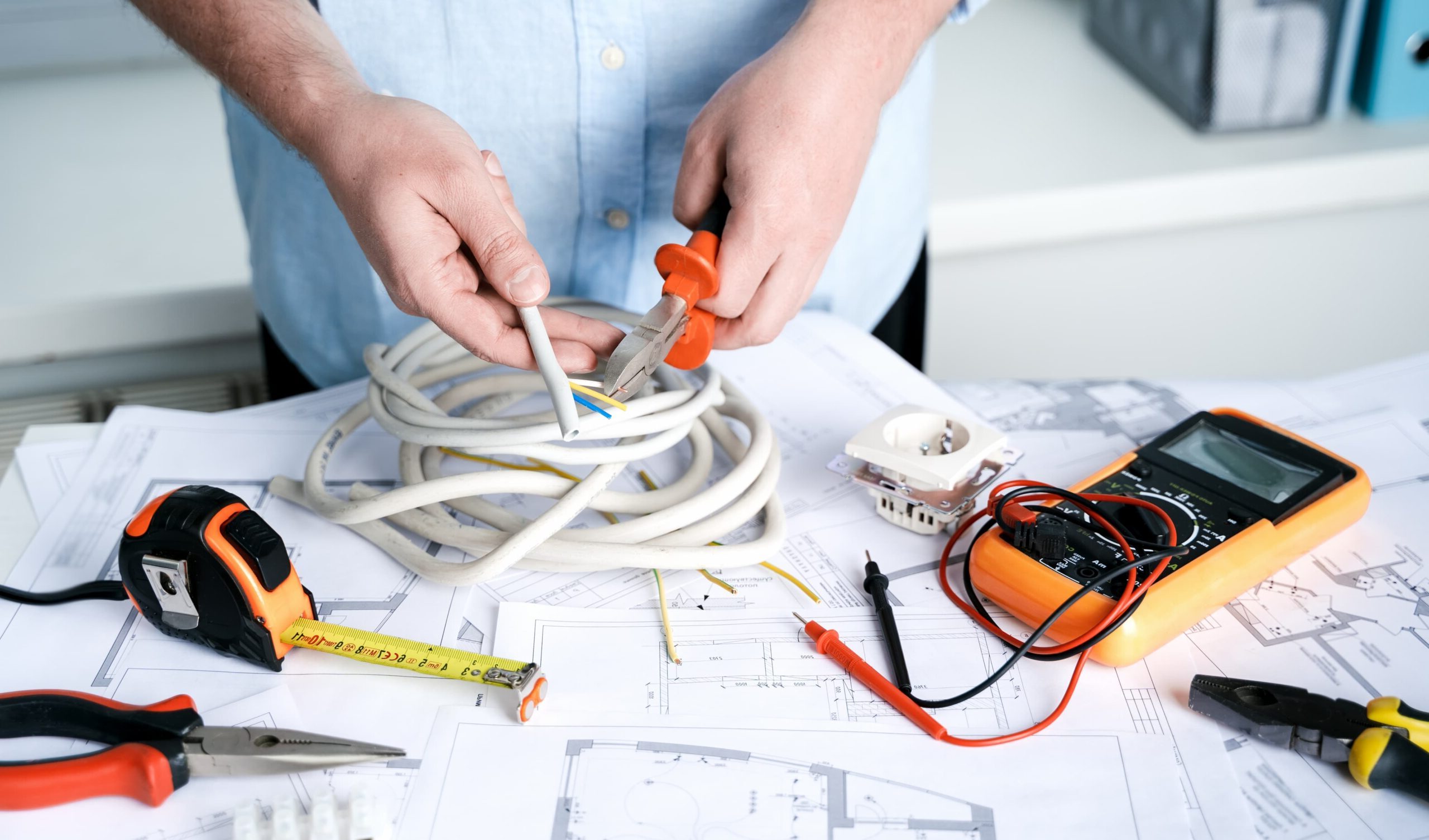 man repairer making electricity project in house