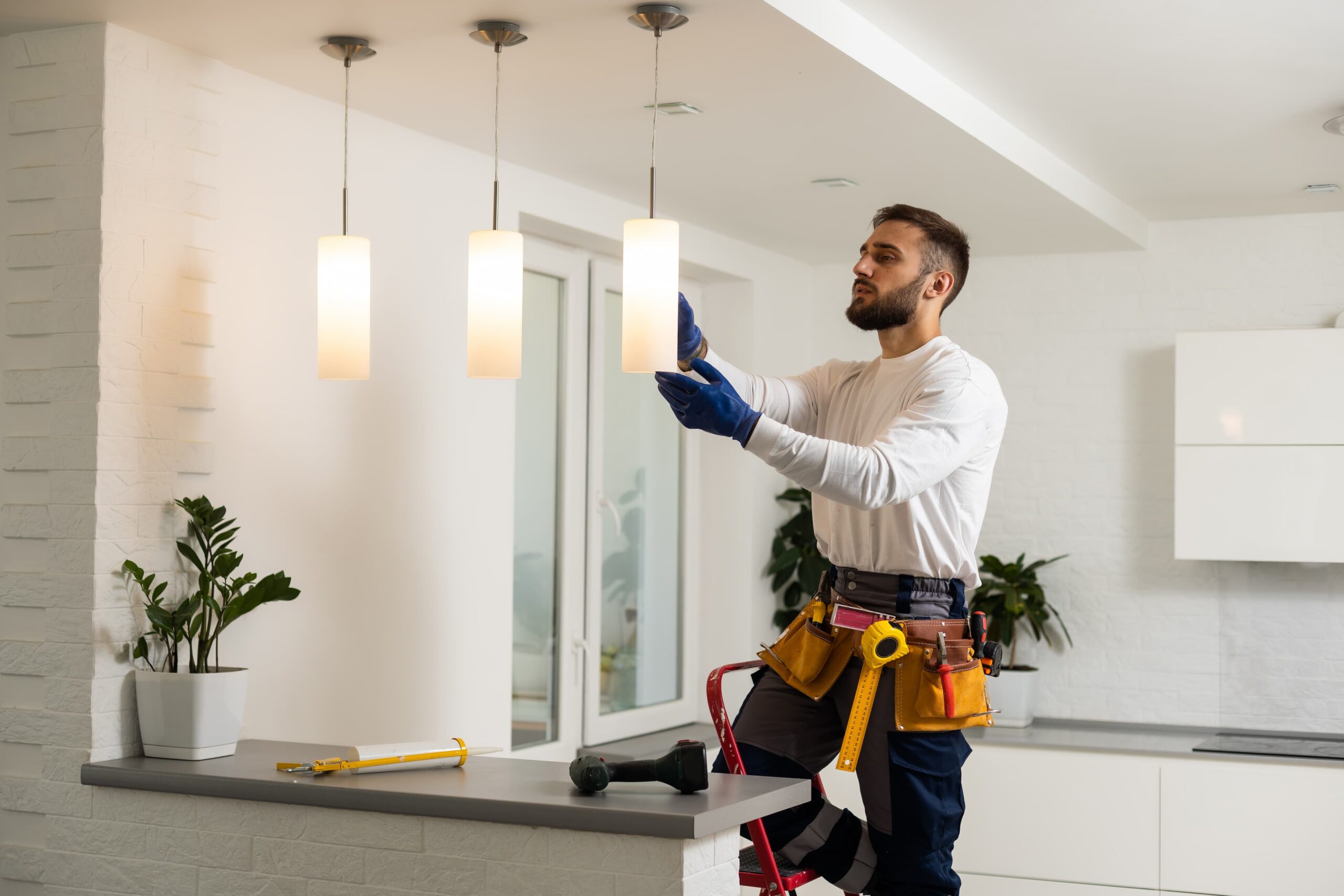 electrician installs lamp lighting
